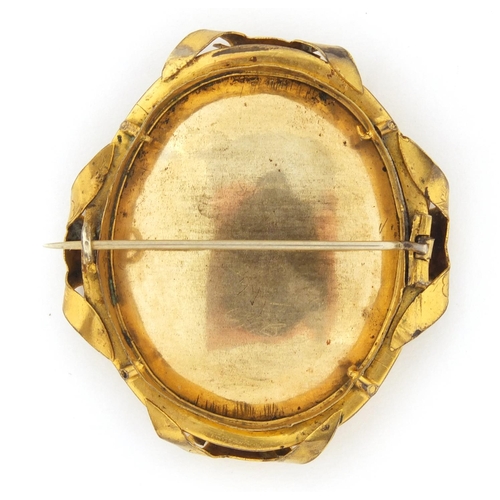 5 - Oval hand painted portrait miniature of an Indian gentleman wearing a hat, housed in a gilt metal br... 