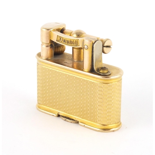 101 - 9ct gold Dunhill pocket lighter with engine turned decoration, patent number 143752, 3.3cm high, app... 
