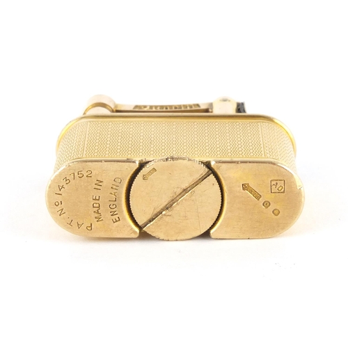 101 - 9ct gold Dunhill pocket lighter with engine turned decoration, patent number 143752, 3.3cm high, app... 