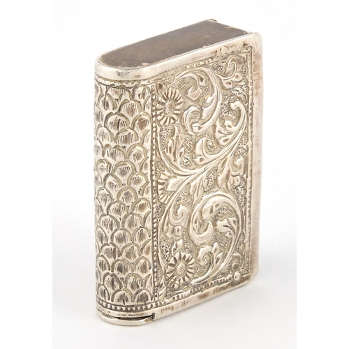 94 - Indian unmarked silver vesta embossed with  flowers and foliage, 5cm high, approximate weight 34.7g