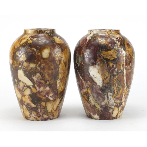 37 - Pair of Victorian variegated marble vases, each 21cm high