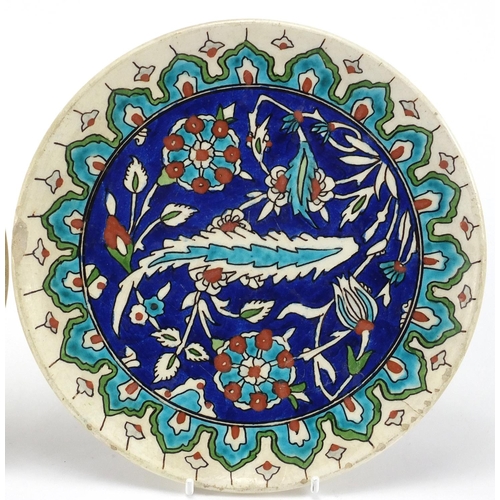 642 - Pair of Kutahya pottery plates both hand painted with stylised flowers, impressed marks to the rever... 