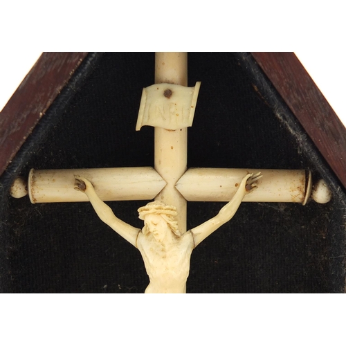 43 - 19th century carved ivory Corpus Christi on cross housed in a case, overall 23cm high
