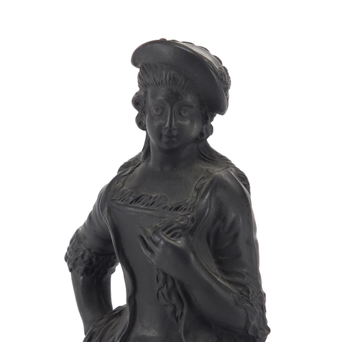 684 - Early 19th century English basalt figure of a lady in traditional dress, 21.5cm high
