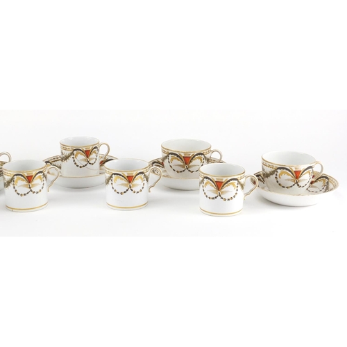 694 - 19th century Spode teaware, hand painted and gilded with flowers and swags, coffee cans 6cm high