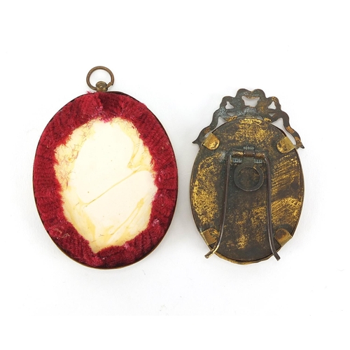 6 - Two oval hand painted portrait miniatures one of a lady and one of a young girl, both housed in bras... 