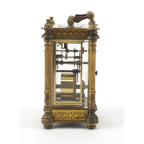 1129 - French brass cased carriage clock, with enamelled chapter ring, blind foliate fretwork and Corinthia... 