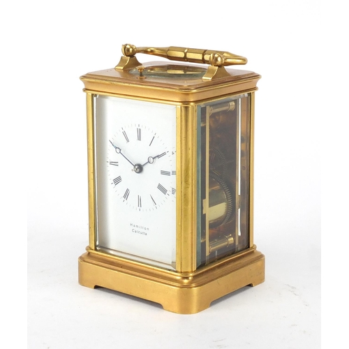 1127 - Gilt brass cased repeating carriage clock by Hamilton, with bevelled glass, enamelled dial and Roman... 