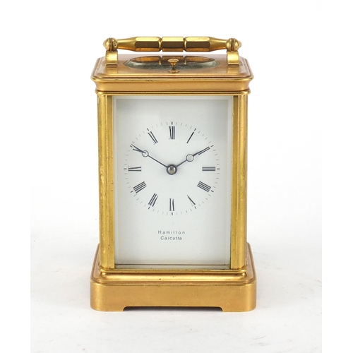 1127 - Gilt brass cased repeating carriage clock by Hamilton, with bevelled glass, enamelled dial and Roman... 