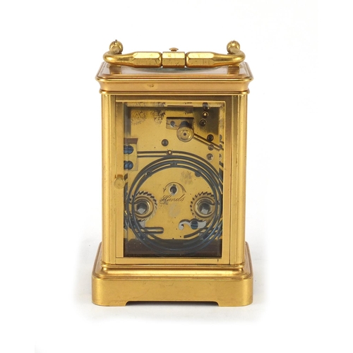 1127 - Gilt brass cased repeating carriage clock by Hamilton, with bevelled glass, enamelled dial and Roman... 