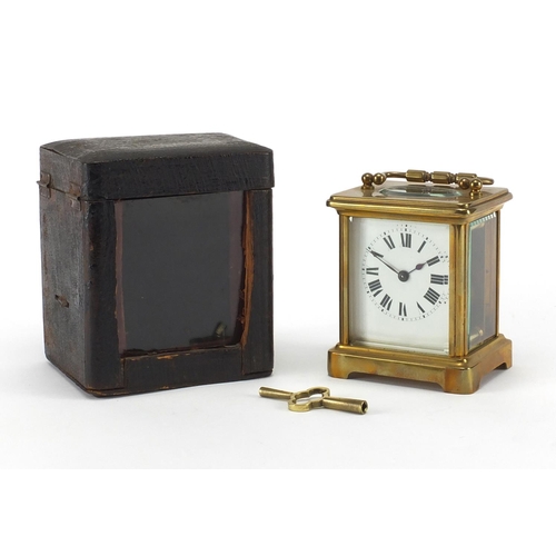 1133 - French brass cased carriage clock with travelling case, the clock with enamelled dial and bevelled g... 