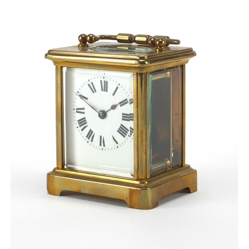 1133 - French brass cased carriage clock with travelling case, the clock with enamelled dial and bevelled g... 