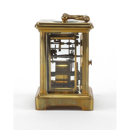 1133 - French brass cased carriage clock with travelling case, the clock with enamelled dial and bevelled g... 