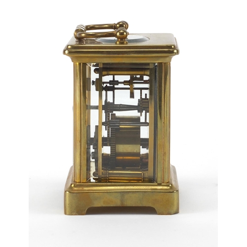 1133 - French brass cased carriage clock with travelling case, the clock with enamelled dial and bevelled g... 