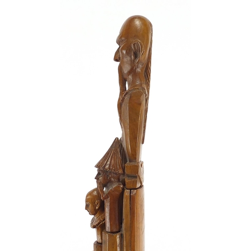 104 - Continental carved olive wood stationary set housed in a sheath all carved with China men, including... 