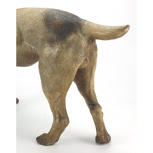 711 - 19th century life size terracotta terrier dog with beaded eyes, 57cm in length