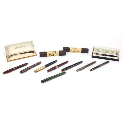 107 - Fountain and dip pens including a green lizard Swan leverless, Parker 17, Slimfold and a red marblei... 