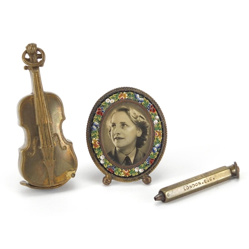82 - Miscellaneous objects comprising a brass violin vesta case, micro mosaic easel photo frame and a Ken... 