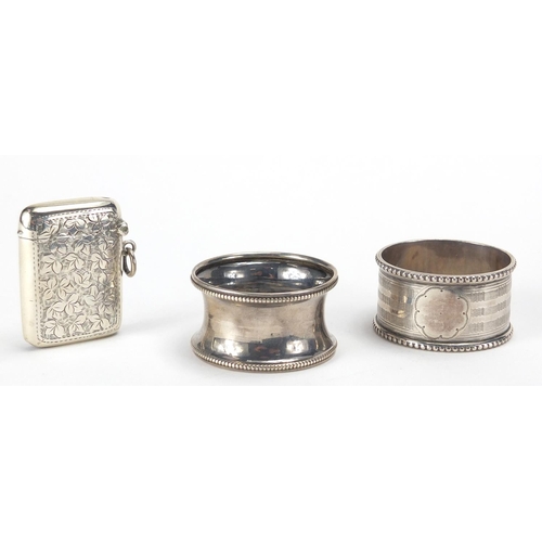 114 - Miscellaneous objects including a silver vesta, two silver napkin rings, fountain pens and propellin... 