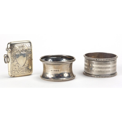 114 - Miscellaneous objects including a silver vesta, two silver napkin rings, fountain pens and propellin... 