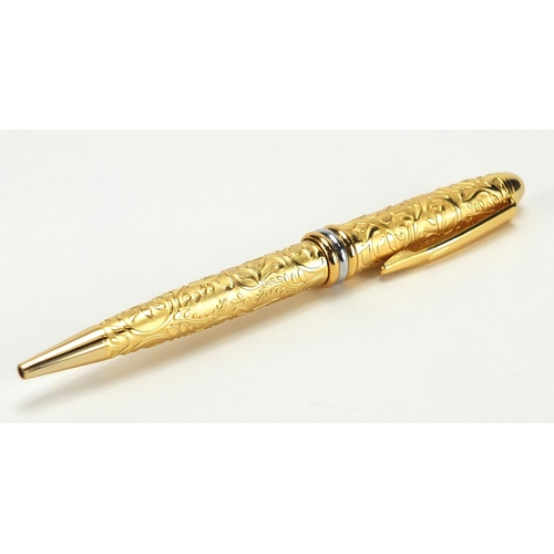 120 - Must De Cartier gold plated ball point pen with foliate decoration, together with certificate and bo... 