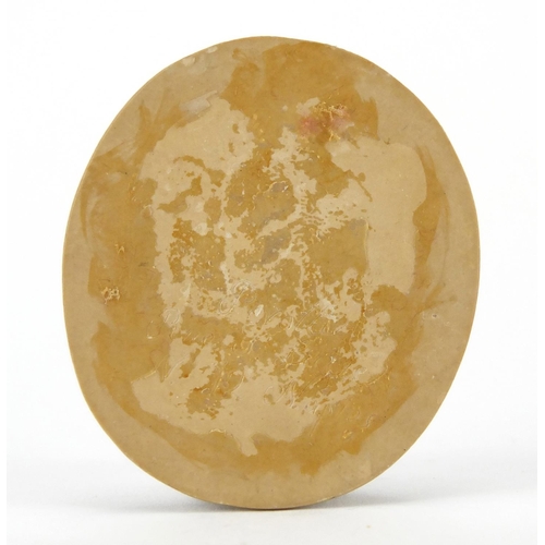 1042 - Oval lava cameo of a maiden holding grapes, 5.3cm x 4.6cm