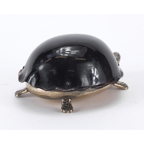 93 - Novelty silver and tortoiseshell vesta in the form of a tortoise, the hinged lid opening to reveal a... 