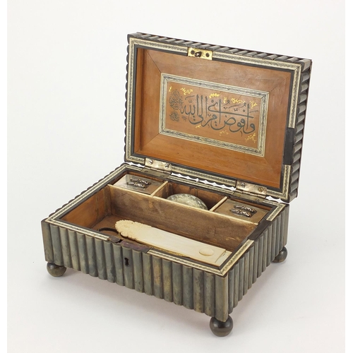 639 - Ottoman horn and ivory inlaid calligraphy box, housing tools and two silver inkwells, the tools incl... 