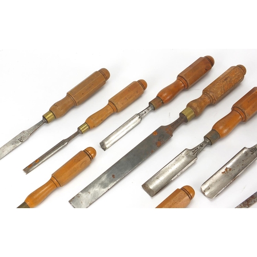57 - Steel bladed carpenters tools comprising three chisels and eight gouges, including Buck & Ryan