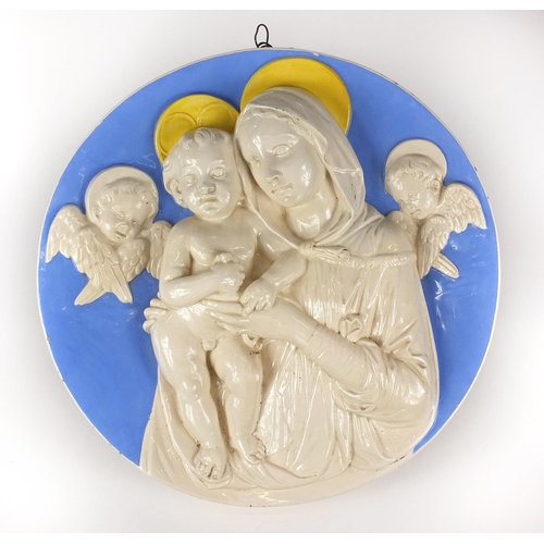 713 - Italian Della Robbia style majolica wall plaque of Madonna and child, factory marks to the reverse, ... 