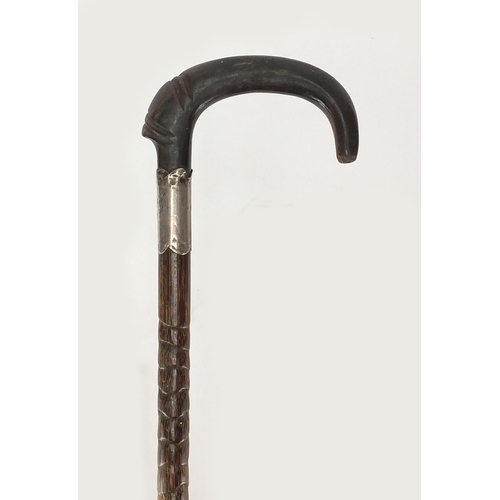 131 - Horn handled walking stick with silver collar, possibly rhino horn, 24.5cm in length