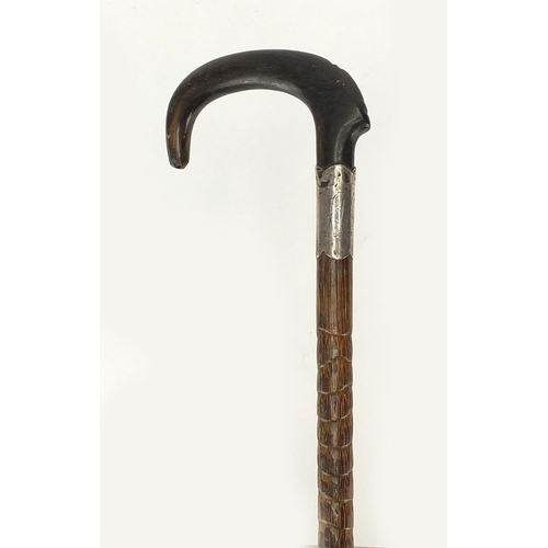 131 - Horn handled walking stick with silver collar, possibly rhino horn, 24.5cm in length