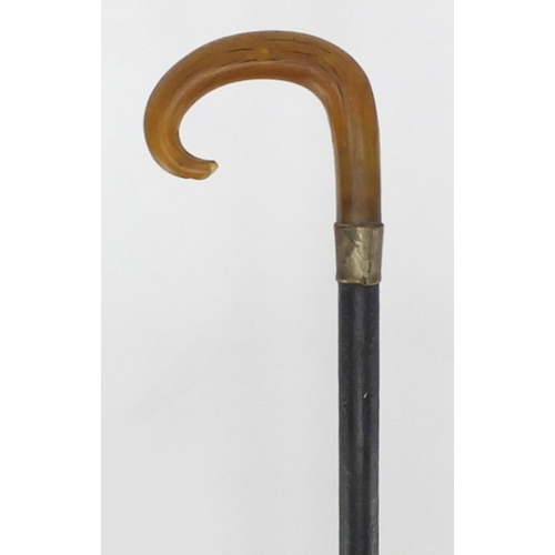 127 - Horn handled ebonised walking stick, possibly rhino horn, 81cm in length
