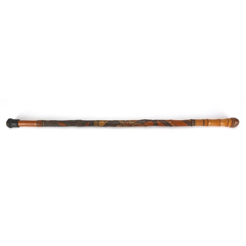 124 - Oriental bamboo walking cane carved with figures, 85cm in length
