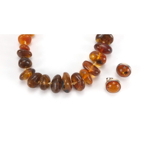 1056 - Natural and Baltic amber necklace and pair of silver amber earrings, the necklace 72cm in length, ap... 