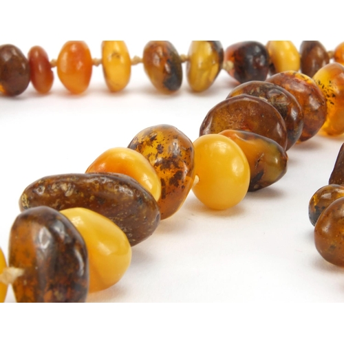 1056 - Natural and Baltic amber necklace and pair of silver amber earrings, the necklace 72cm in length, ap... 