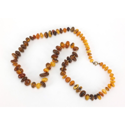 1056 - Natural and Baltic amber necklace and pair of silver amber earrings, the necklace 72cm in length, ap... 