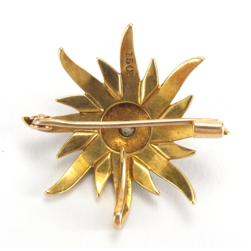 1021 - 15ct gold seed pearl star burst brooch set with a central diamond, 2.8cm in diameter, approximate we... 