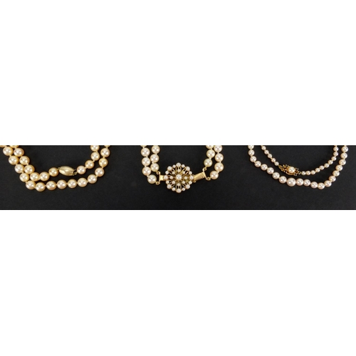 1048 - Three pearl necklaces with gold clasps, one set with sapphires, the largest 90cm in length, approxim... 