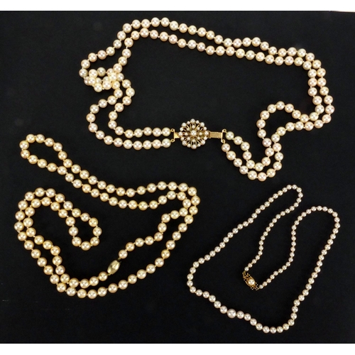 1048 - Three pearl necklaces with gold clasps, one set with sapphires, the largest 90cm in length, approxim... 