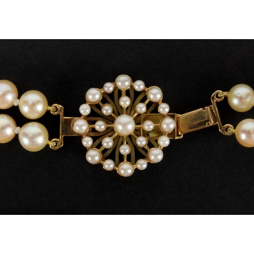 1048 - Three pearl necklaces with gold clasps, one set with sapphires, the largest 90cm in length, approxim... 