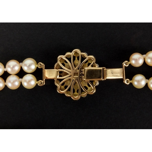 1048 - Three pearl necklaces with gold clasps, one set with sapphires, the largest 90cm in length, approxim... 