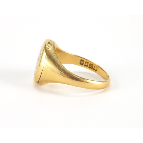 1017 - 18ct gold enamelled signet ring with hinged front, size P, approximate weight 8.7g