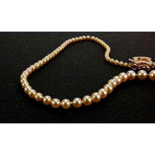 958 - Single string natural pearl necklace with 18ct gold diamond clasp, 46cm in length, approximate weigh... 