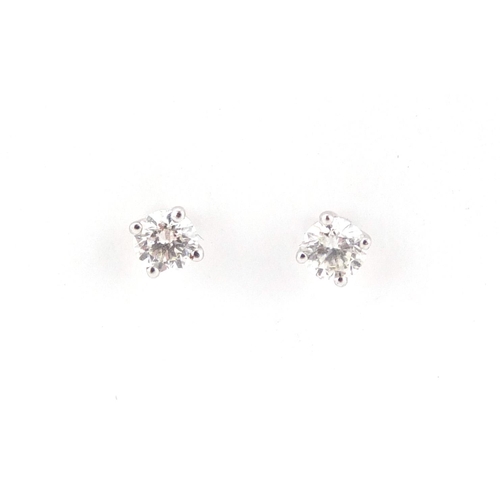 1025 - Pair of 18ct white gold diamond solitaire earrings, approximate weight 1.0g