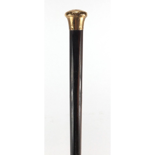 121 - 9ct gold mounted exotic wood walking cane by Kendall, with brass ferrule, 92cm in length