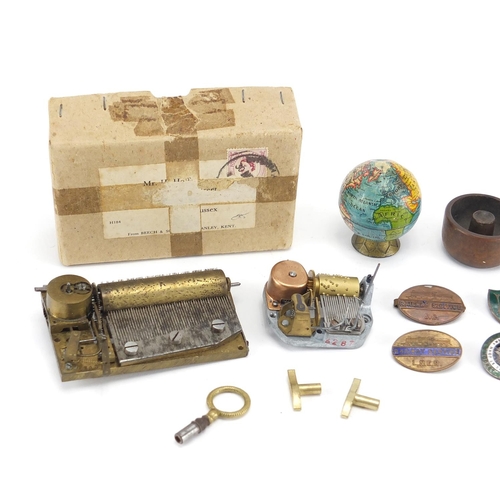 86 - Miscellaneous objects including domino vesta, music box movements and railway brooches