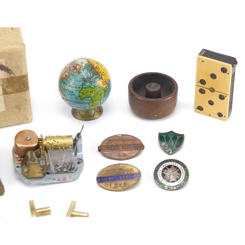 86 - Miscellaneous objects including domino vesta, music box movements and railway brooches
