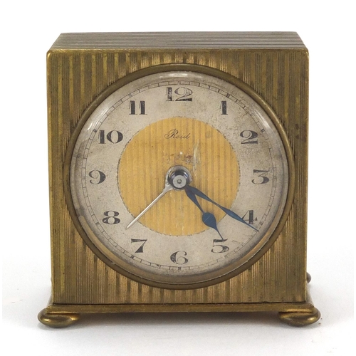 1135 - Art Deco brass travel alarm clock retailed by Reid  & Sons, with fitted case, 5.8cm high