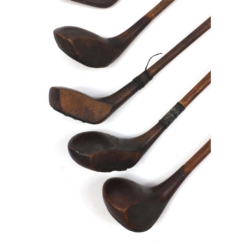227 - Ten wooden shafted golf clubs some with impressed marks